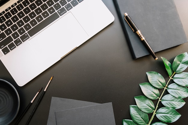 Modern office desk composition with technological device