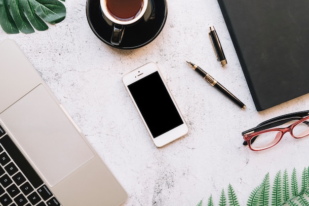 Modern office desk composition with technological device