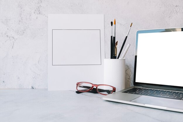 Modern office desk composition with technological device