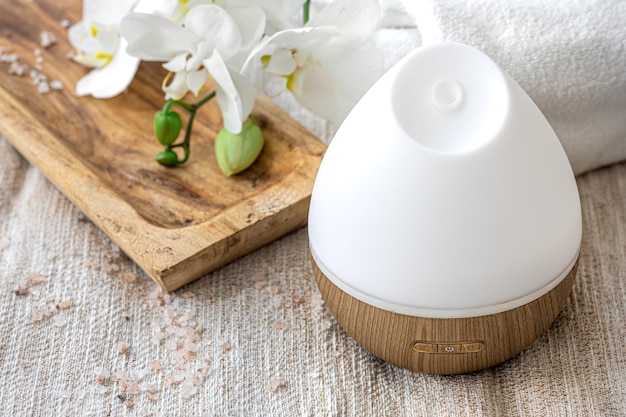 Modern oil aroma diffuser close up on a blurred background