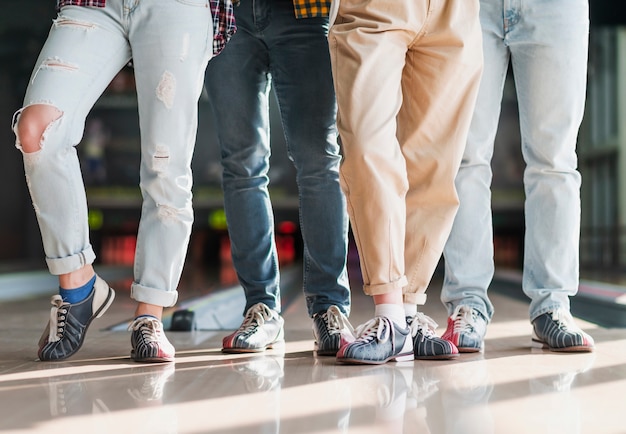 Modern people standing in a bowling club