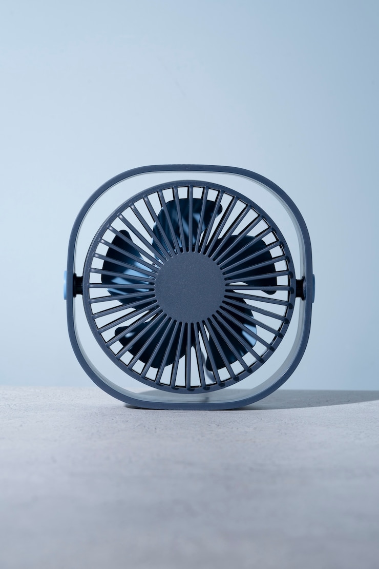 Free Photo modern round desk fan with simple background