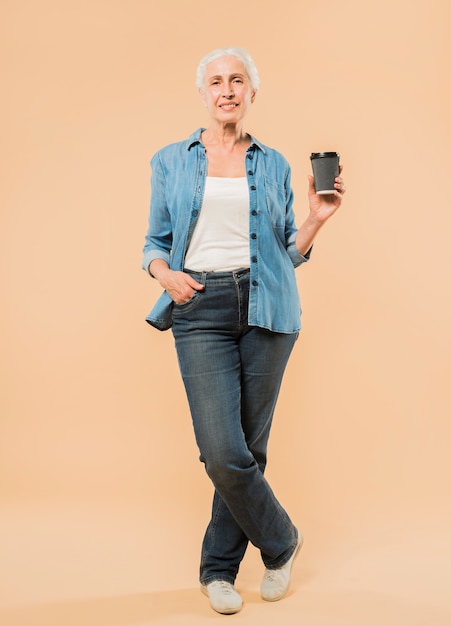 Modern senior woman with coffee cup