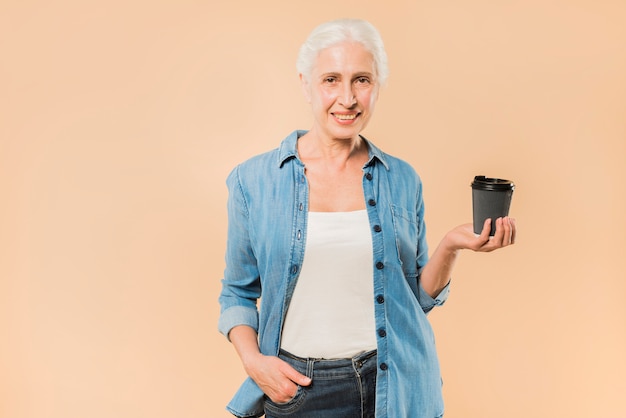 Modern senior woman with coffee cup