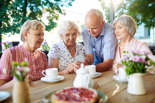 Modern seniors with smartphone