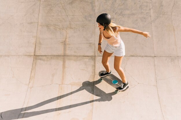 Modern sporty girl skating