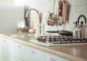 Free photo modern stylish scandinavian kitchen interior with kitchen accessories.