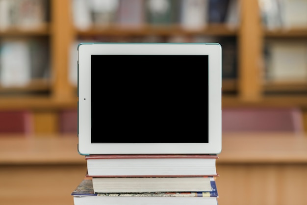 Modern tablet on books