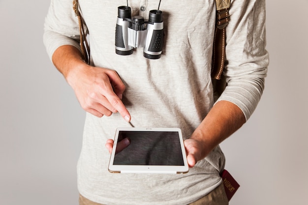 Modern tourist holding tablet