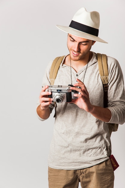 Modern tourist looking at camera