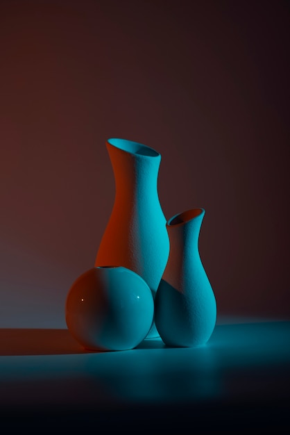 Free photo modern vases with blue and red light