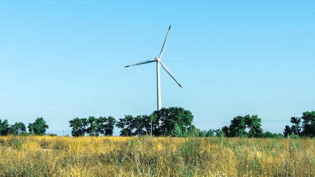 Modern wind turbines against the blue sky