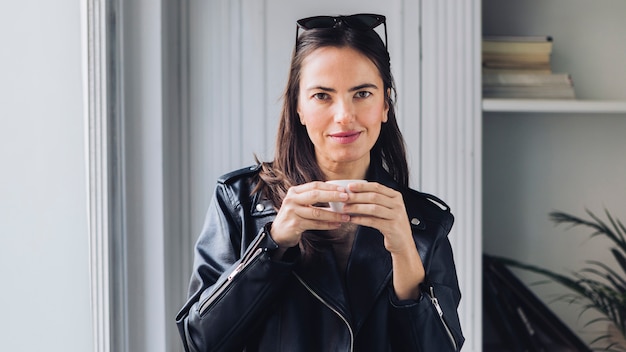 Modern woman drinking coffee