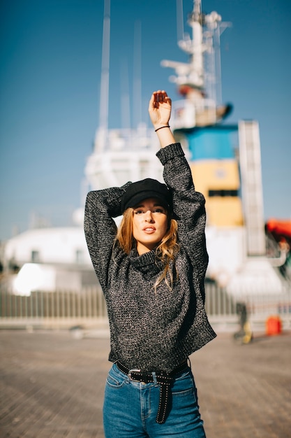 Free photo modern woman in front of ship