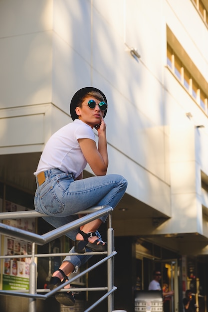 Modern woman portrait wearing stylish round glasses hanging out