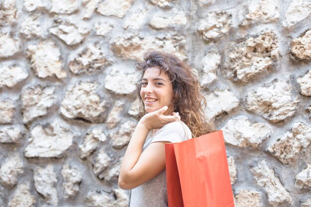 Modern woman posing with shopping bags