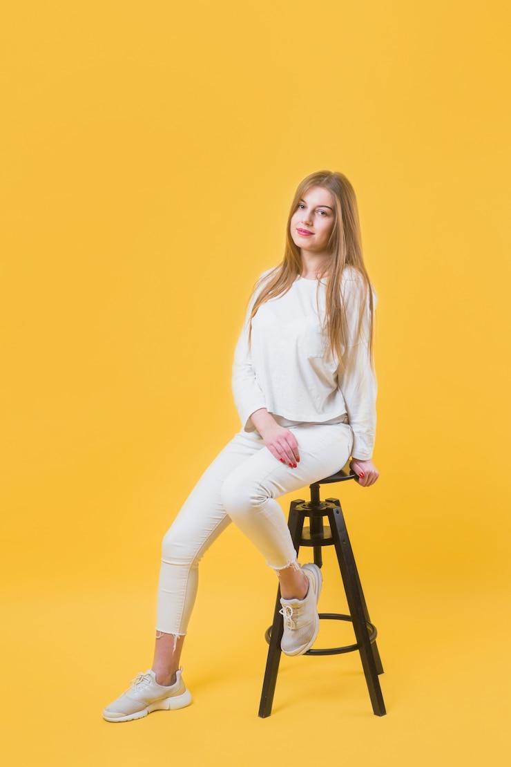 Free Photo modern woman on stool