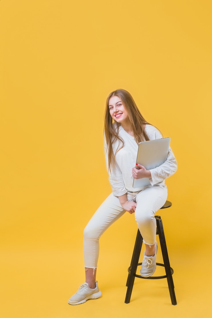Free Photo modern woman on stool