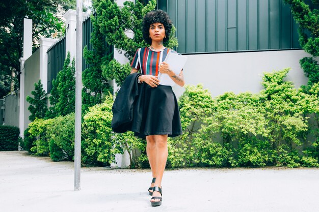 Modern woman walking on the street