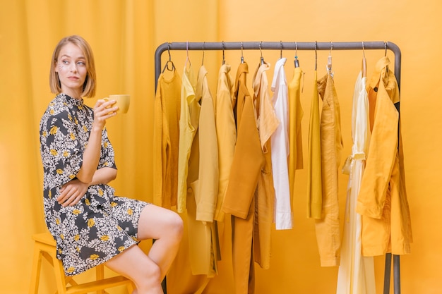 Free photo modern woman next to wardrobe