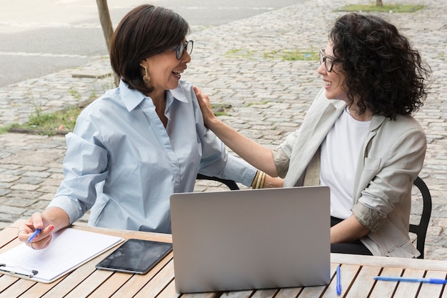 Modern women working together 
outside