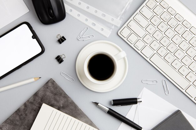 Modern workplace arrangement with cup of coffee