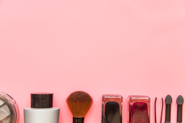 Moisturizing cosmetic products on pink backdrop