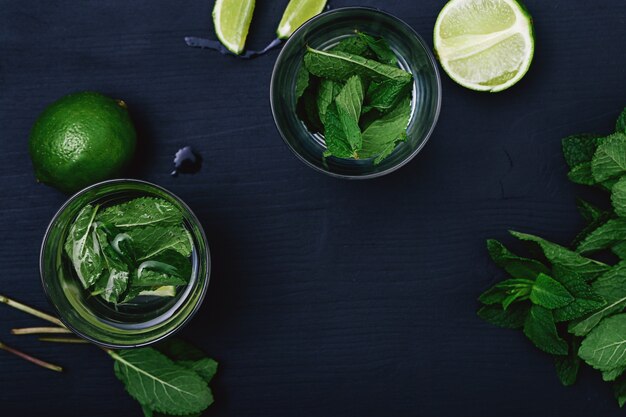 Mojito cocktail in glasses with lime and mint