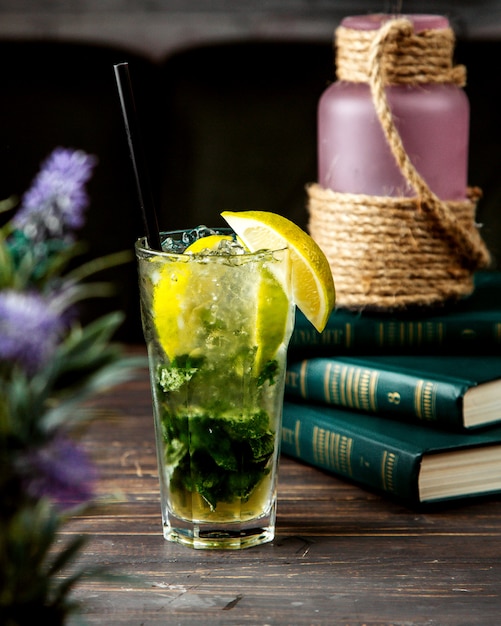 Mojito cocktail with some books on the table