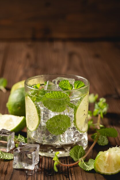 Mojito cocktail on wooden table.