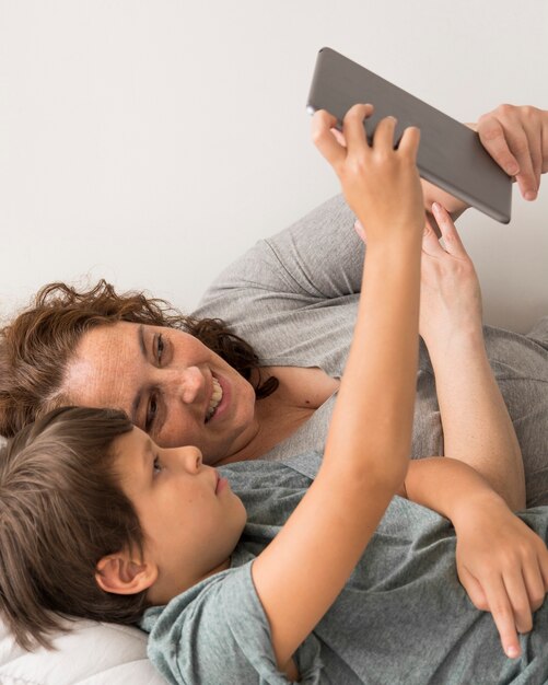 Mom and child looking on tablet