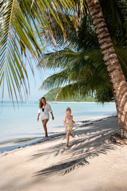 Mom and daughter enjoying their sunny holiday