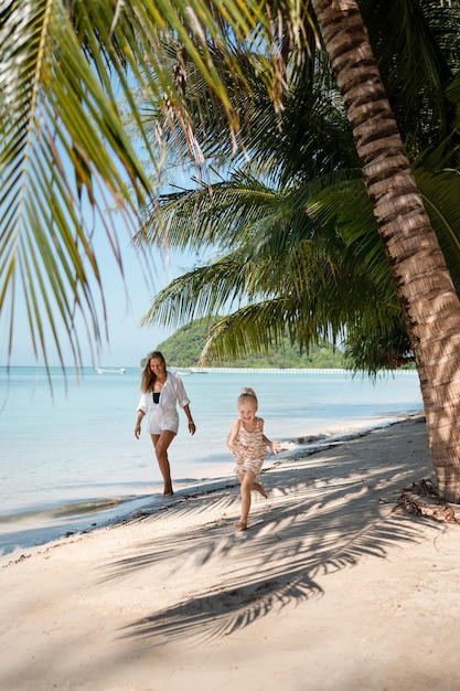 Mom and daughter enjoying their sunny holiday