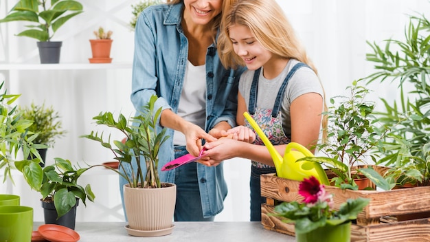 Mom and daughter in greenhouse