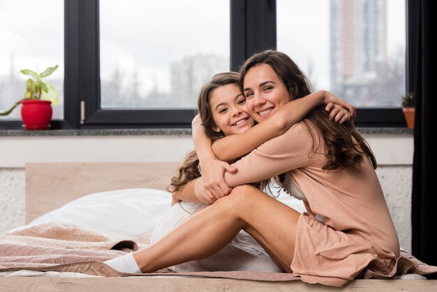 Mom and daughter hugging each other