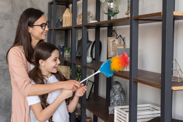 Mom and girl cleaning