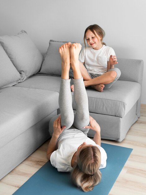 Mom and girl exercising