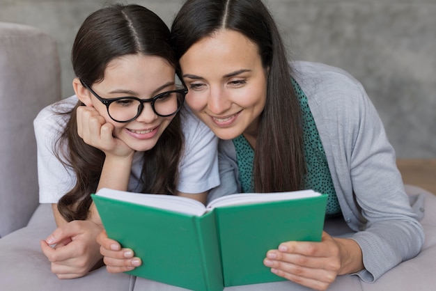 Mom and girl reading