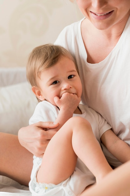 Mom holding cute baby