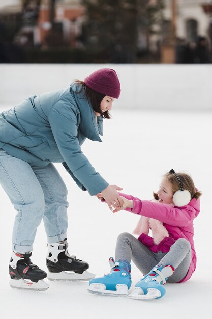 Mom holding falling daughter