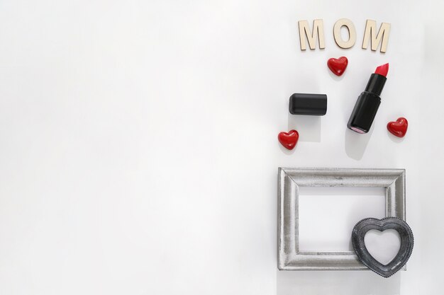 Mom lettering, lipstick and frame with heart