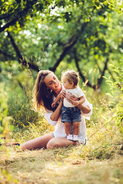 Mom and little girl having fun in the garden