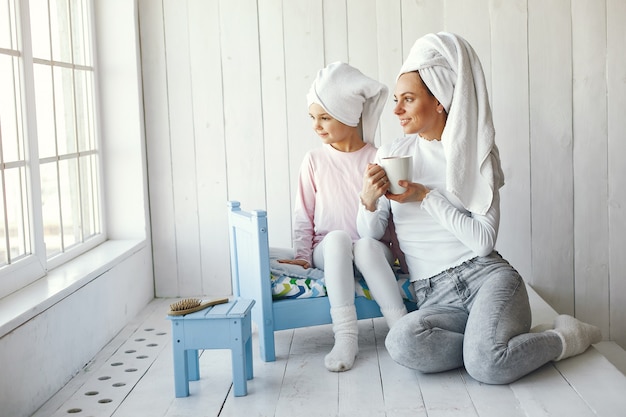 Mom playing with cosmetics with her daughter