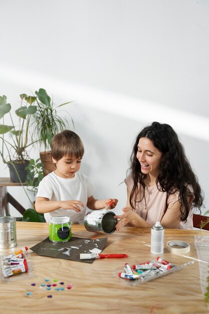 Mom showing kid how to reuse materials in creative ways