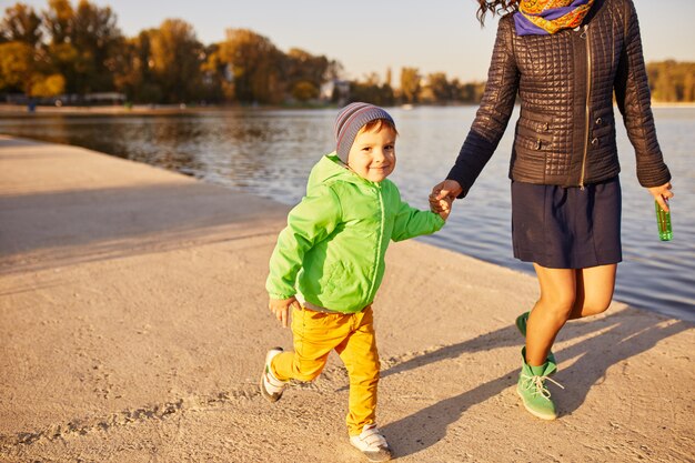 Mom and son having fun by the lake