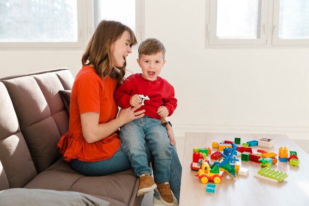 Mom and son playing with toys