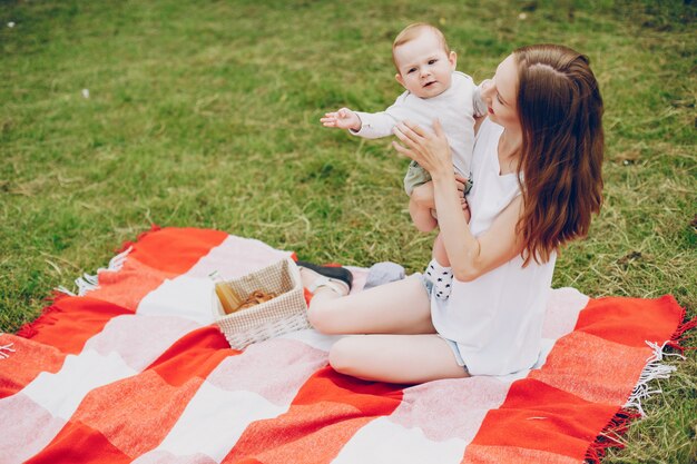 Mom and son relax in the park.