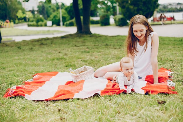 Mom and son relax in the park.