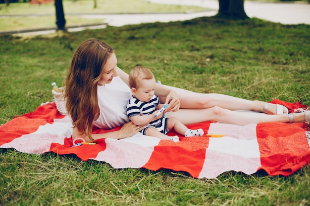 Mom and son relax in the park.