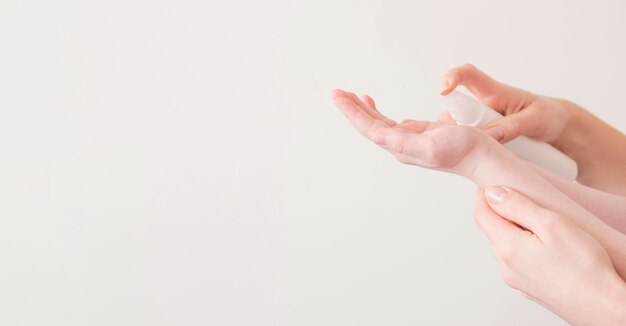 Mom and son using hand sanitizer